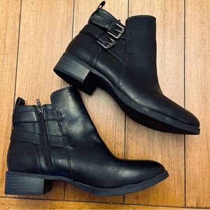 Black leather ankle booties with silver buckle hardware